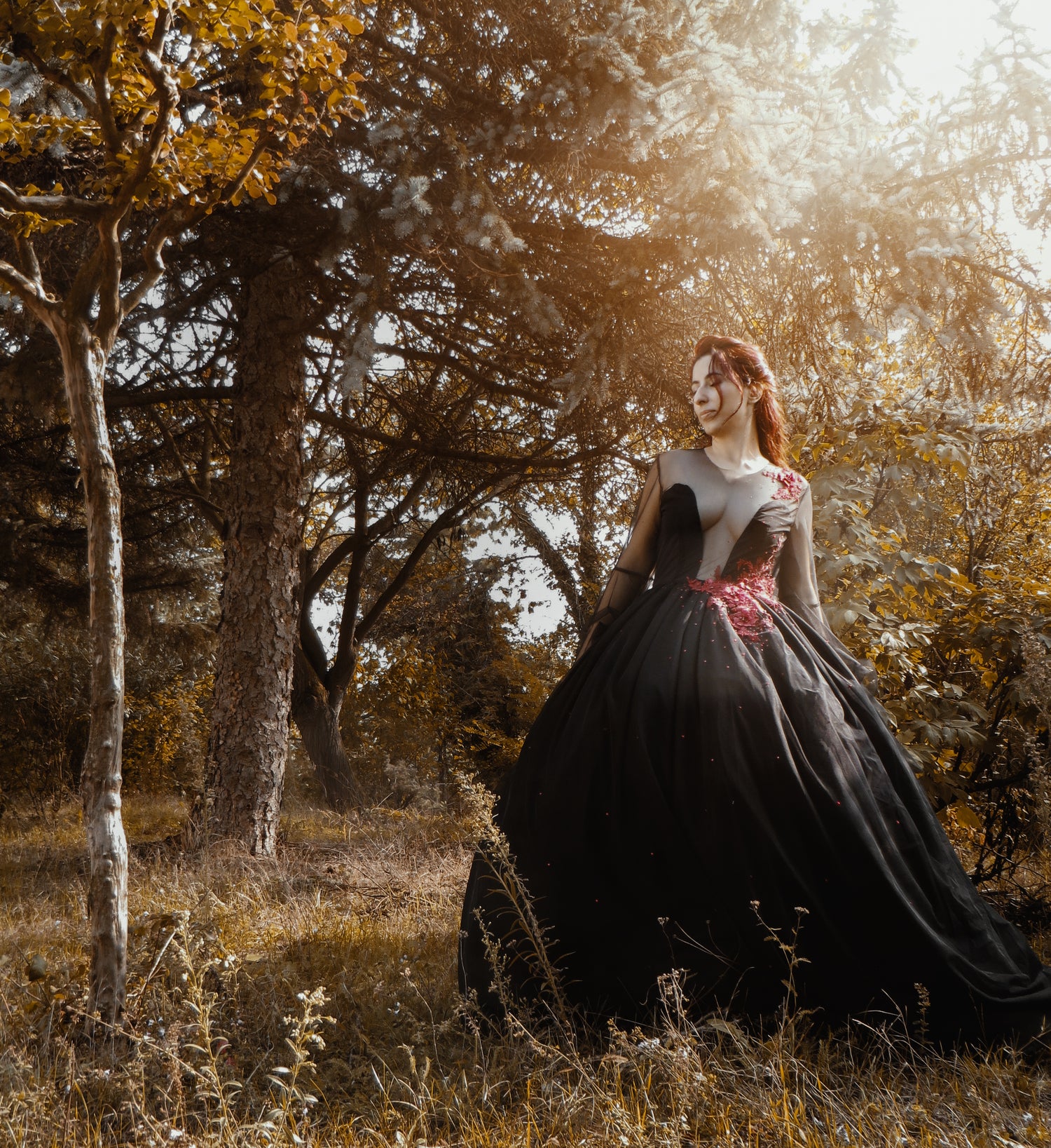 alternative wedding dress, crafted with black tulle, red 3D lace, and hand-placed red rhinestones, creating a mesmerizing, gothic-inspired look