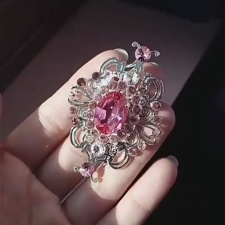 Soft pink tulle wedding gown with metal filigree decorations, white and pink crystals and plating fabric on the bust. Video details of the metal filigree decorations